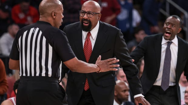 Indiana Hoosiers coach Mike Woodson talks with an official during the first half against the Connecticut Huskies at Madison Square Garden.